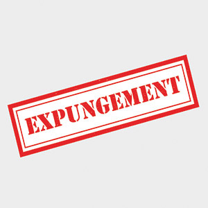 Red stamp showing the word EXPUNGEMENT. Legal record clearance, criminal law